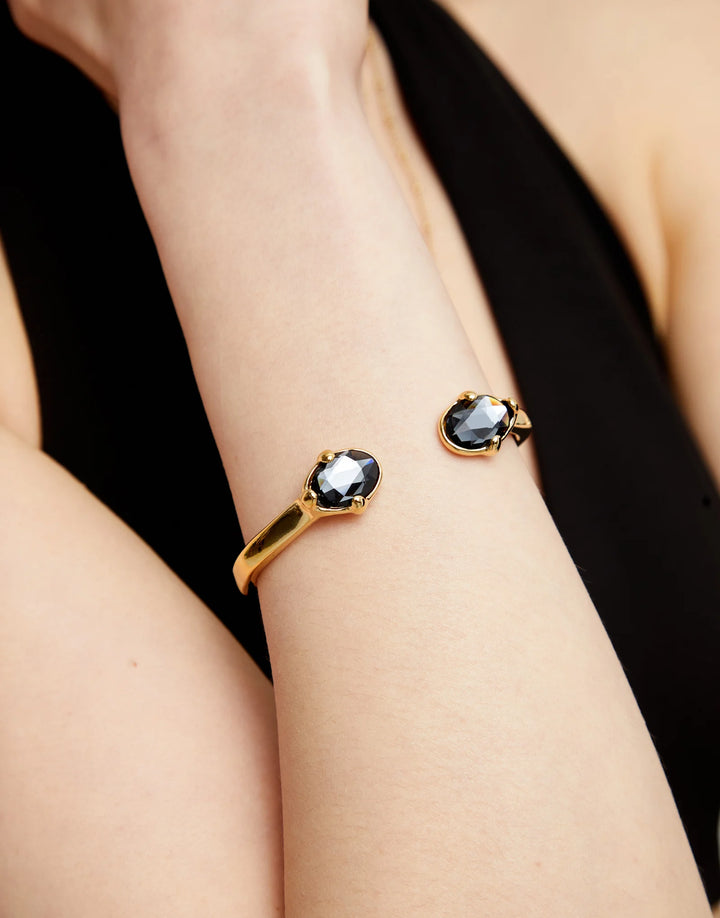UNODE50 Bangle bracelet with two faceted black oval crystals - Gold
