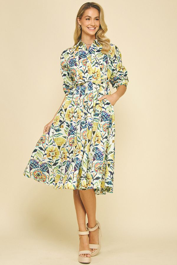 Woman wearing a floral dress on a beige background
